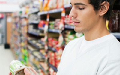 Man Looking at Nutrition Labels