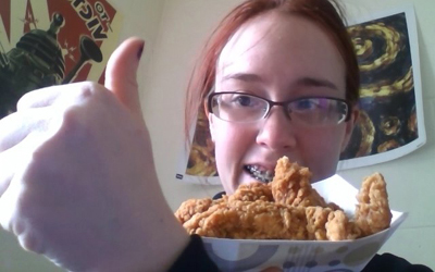 Female Eating Chicken