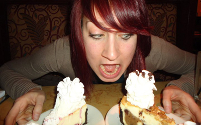 Woman Eating Cheesecake